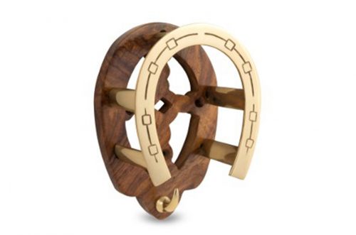 brass and wood horseshoe rack